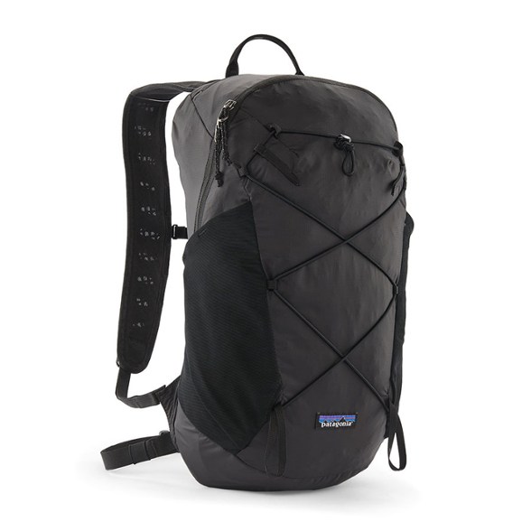 Patagonia Terravia 14L backpack in a scenic mountain setting, showcasing its lightweight design and removable raincover.