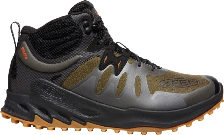 Side view of Zionic Adventure Mid Waterproof Hiking Boots for Men on rocky terrain.