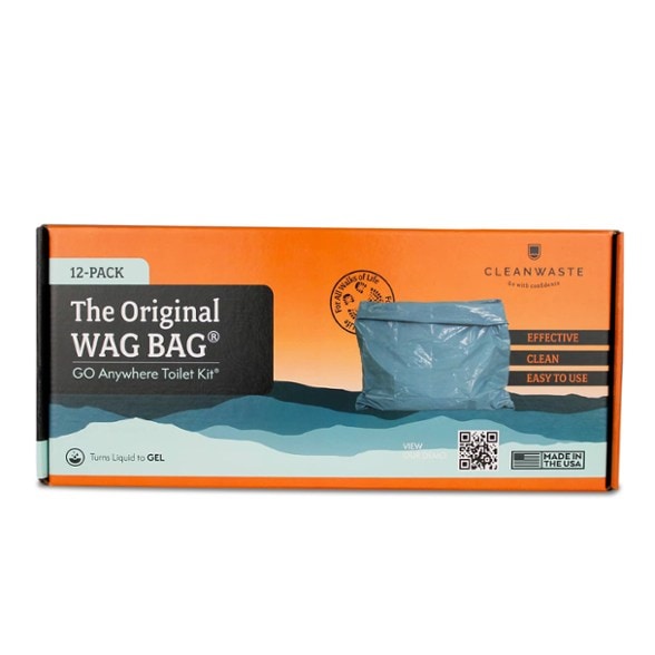 TrailGuard wag bag toilet kit shown with contents: waste bag, deodorizer, toilet paper, and wipe