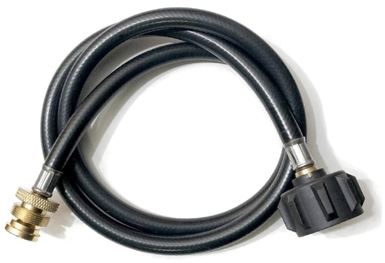 Close-up of the Ignik propane adapter hose connected to a camping stove