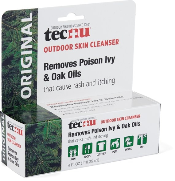 Nature's Shield Poison Oak & Ivy Cleanser bottle in a natural outdoor setting