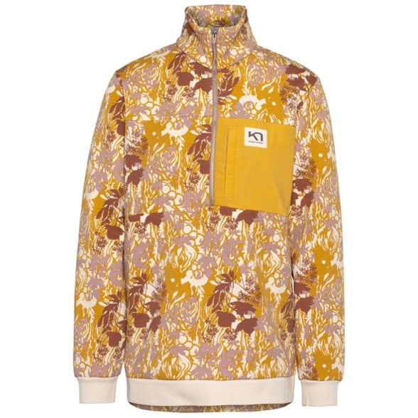 Ruth Eco Mid-Layer Pullover for Women displayed in a natural outdoor setting, emphasizing warmth and style.