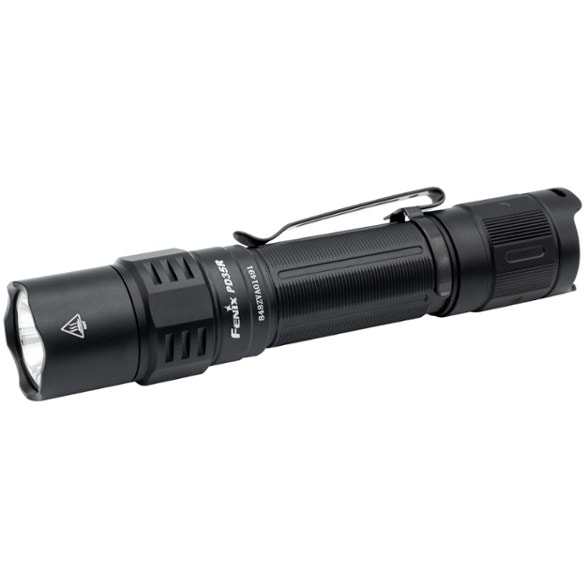 Fenix PD35R Pro LED flashlight in a camping setting, showcasing its bright light output.