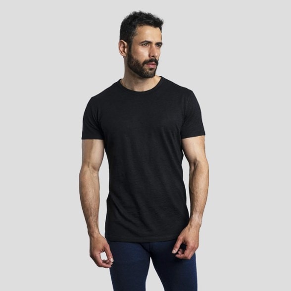 Men's ultralight alpaca wool t-shirt in outdoor setting, showcasing moisture-wicking properties.