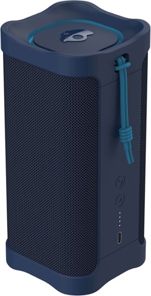 Terrain XL Waterproof Bluetooth Speaker at a backyard BBQ, showcasing its durable design.