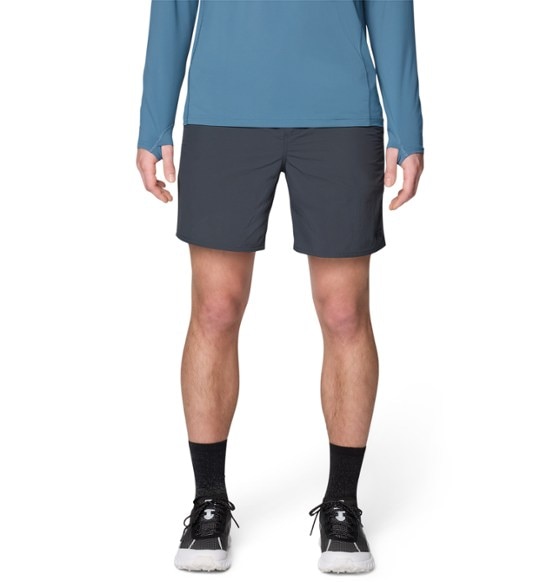 Men's Eco Adventure swim shorts displayed at the beach, showcasing pockets and quick-dry fabric.