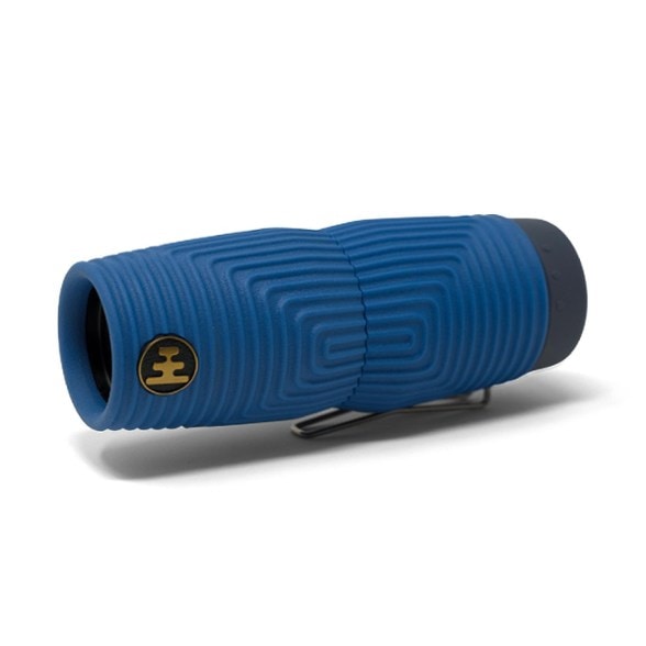 Nocs Provisions Zero Tube monocular held in hand during a hike, showcasing its compact size.