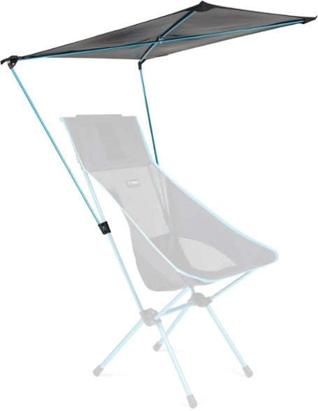 Helinox Versatile Beach Canopy clipped to a Helinox chair at the beach, showcasing its adjustable shade feature.