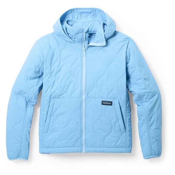 Bessie women's packable insulated travel jacket in a scenic outdoor setting