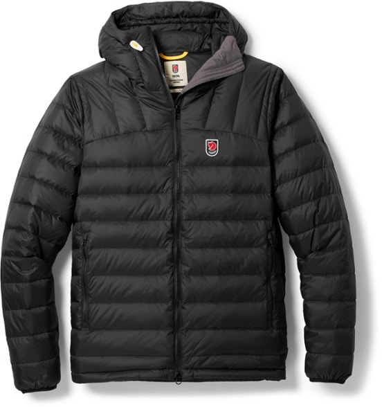Fjallraven Expedition Down Hoodie in action during a winter hike, showcasing its warmth and style.