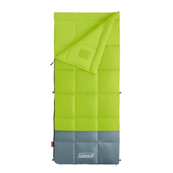 Coleman Kompact 30°F sleeping bag in a camping setup under trees