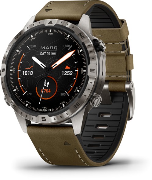 Garmin MARQ Gen 2 Adventure Smartwatch on a rocky mountain trail, highlighting its outdoor capabilities.