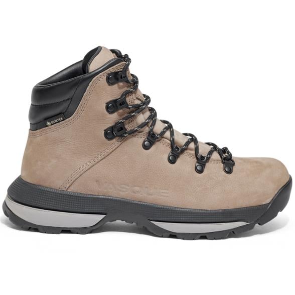 Side view of Vasque men's hiking boots showcasing full-grain leather and Vibram sole on rocky terrain