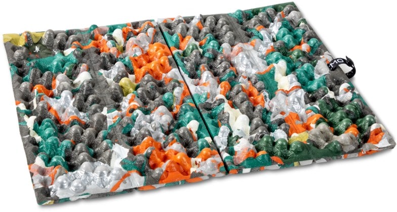 Top-down view of the TrailNest camping seat pad showing hexagonal contours and recycled foam texture