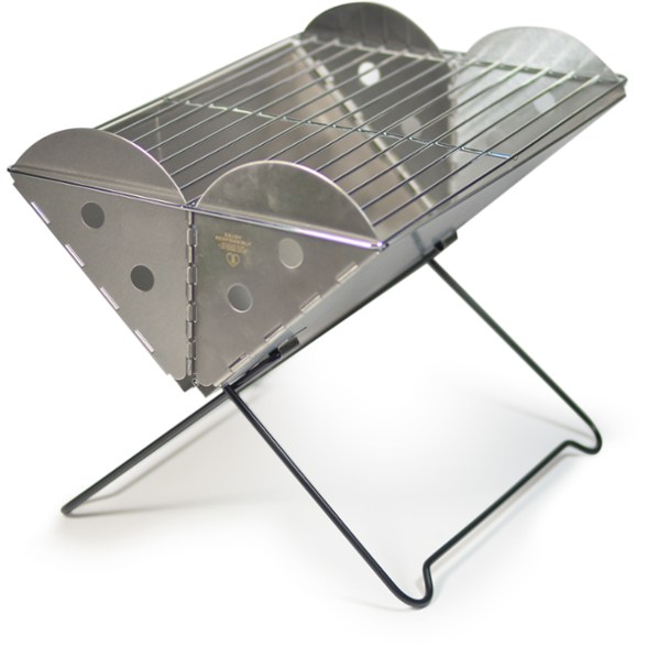 UCO Flatpack grill set up at a campsite, showcasing its compact design.