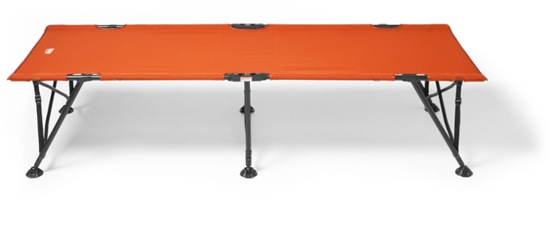 Side view of portable camping bed showing durable folding cot frame and waterproof fabric in forest setting