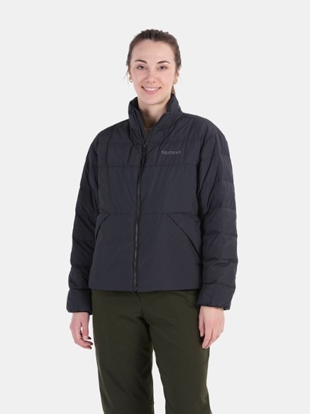 Front view of women's insulated hiking jacket in charcoal grey with zipper pockets and eco-friendly design