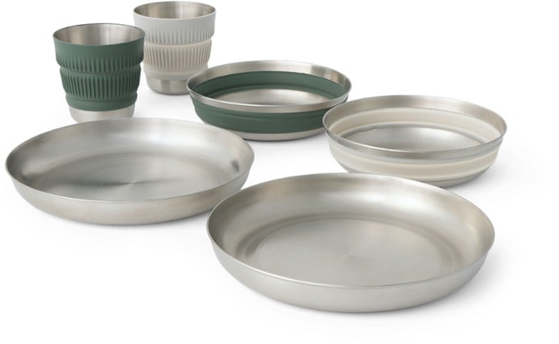 Detour stainless steel plates stacked with collapsible bowls, perfect for camping meals.
