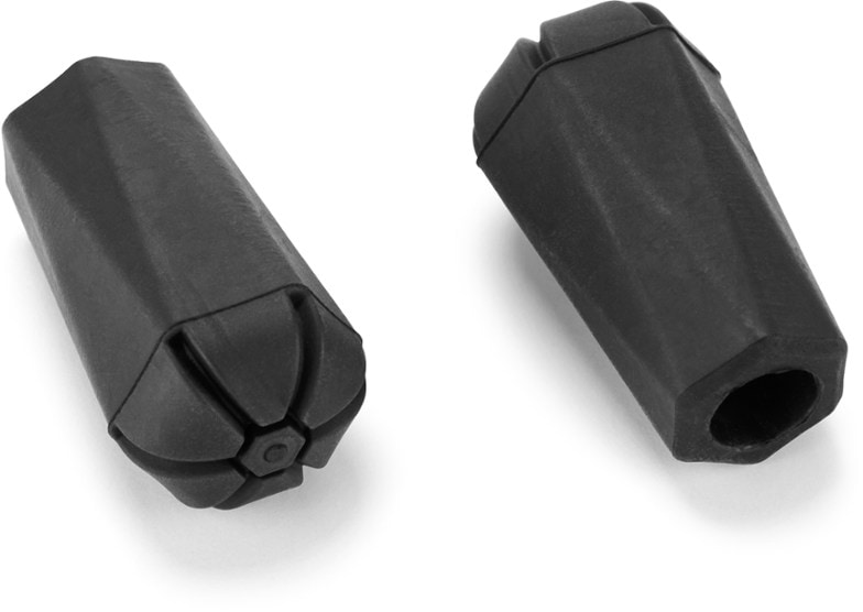 Close-up of durable trekking pole tips for hiking poles showing thick rubber grip and flat base