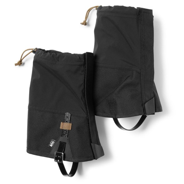 Close-up of SaharaShield gaiters wrapped around hiking boots on muddy terrain