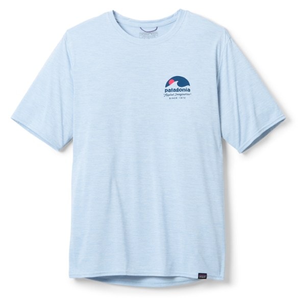 Eco-Friendly Capilene Cool Daily Graphic Tee in action on a hiking trail