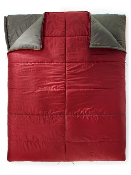 MegaSleep Duo 25/40 sleeping bag in a forest setting, demonstrating its dual configuration.