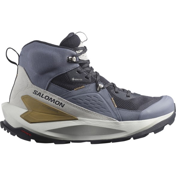 Side view of Salomon Elixir Mid GORE-TEX hiking boots on rocky terrain.