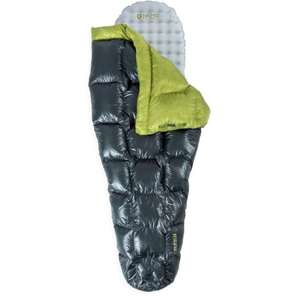 Side view of the NEMO Pulse Ultralight Backpacking Quilt in a camp setting, showcasing its lightweight design.
