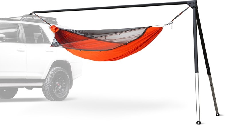 Kammok Outpost Portable Hammock Stand set up in a campsite with hammock attached, demonstrating its ease of use.