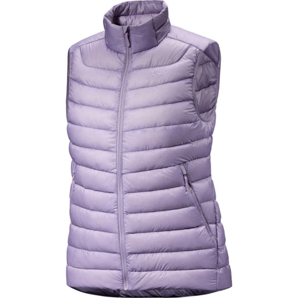 Front view of the AlpineLite women's down vest worn over a softshell, highlighting the high collar and contoured fit.