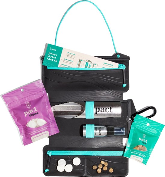 PACT Outdoors Portable Sanitation Kit displayed in a natural setting, showcasing its compact design.