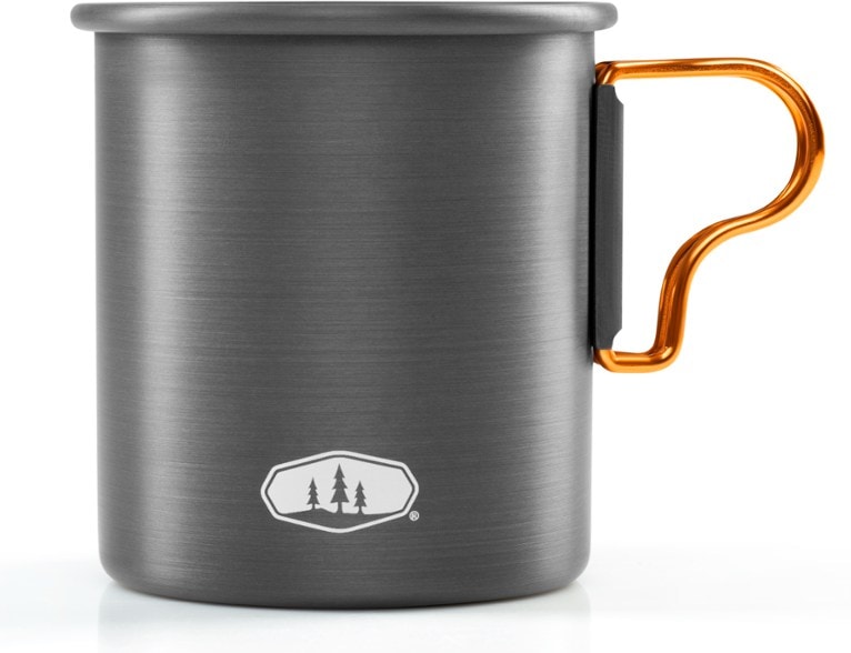 GSI Outdoors lightweight aluminum camping mug shown in a hiking setting