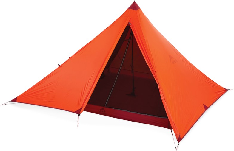 Alpine Haven 4-Person Ultralight Tarp Shelter pitched in a scenic mountain area, demonstrating its spacious design for backpackers.