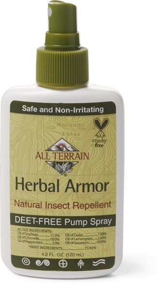 Close-up of ArmorNaturals bug spray bottle showing DEET-free labeling and essential oils blend