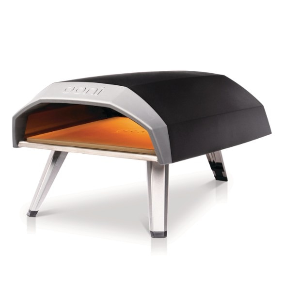 Top-down view of the FlameStone gas pizza oven in use, featuring a bubbling 12-inch pizza on a stone