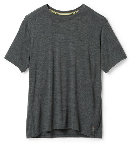 Men wearing the Ultimate Merino Wool T-Shirt during a hiking trip, showcasing its lightweight and breathable design.