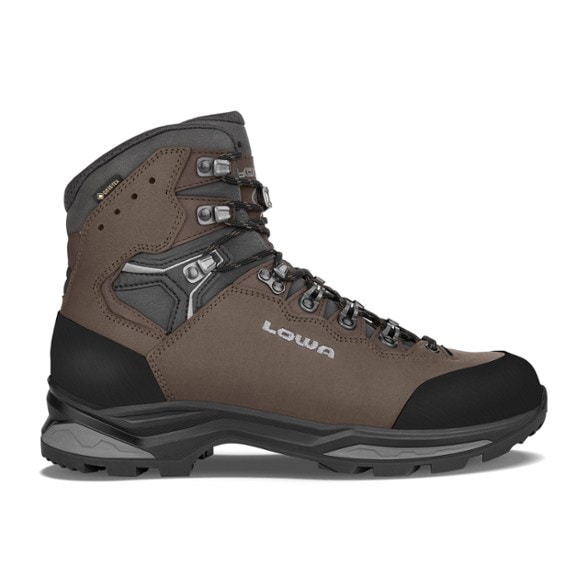 Lowa Camino Evo GTX hiking boots on rocky terrain, showcasing ankle support and GORE-TEX waterproofing.