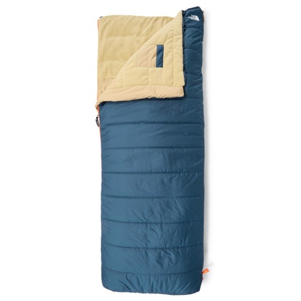 Wawona Bed 20 outdoor sleeping bag in a campsite setting, showcasing its rectangular design and vibrant color.