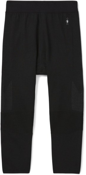Front view of men's 3/4 merino base layer pants worn on hiking trail