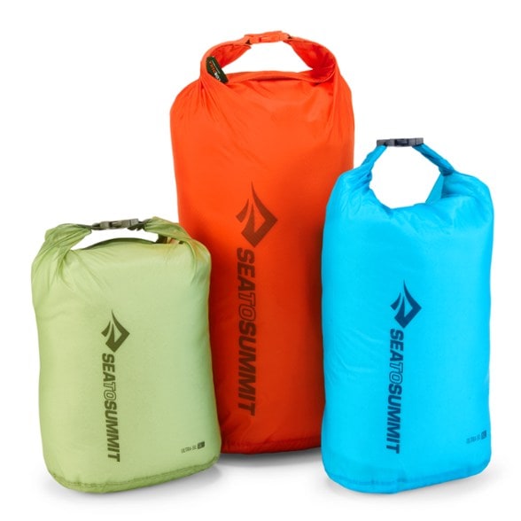 Top view of the Ultra-Sil dry bag trio pack displayed flat with visible color difference and rolled tops
