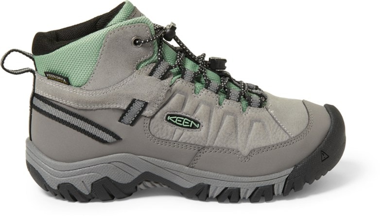 Targhee IV Mid Waterproof Hiking Boots for Kids in action on a trail.