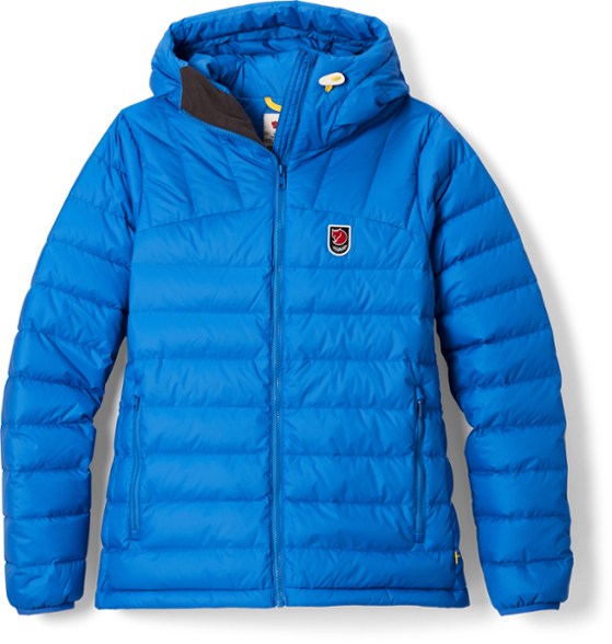 Fjallraven Women's Expedition Packable Down Hoodie in snowy landscape, showcasing its warmth and comfort.