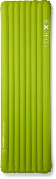 Exped Ultra 3R sleeping pad in a tent, showcasing its comfort and thickness against rocky terrain.