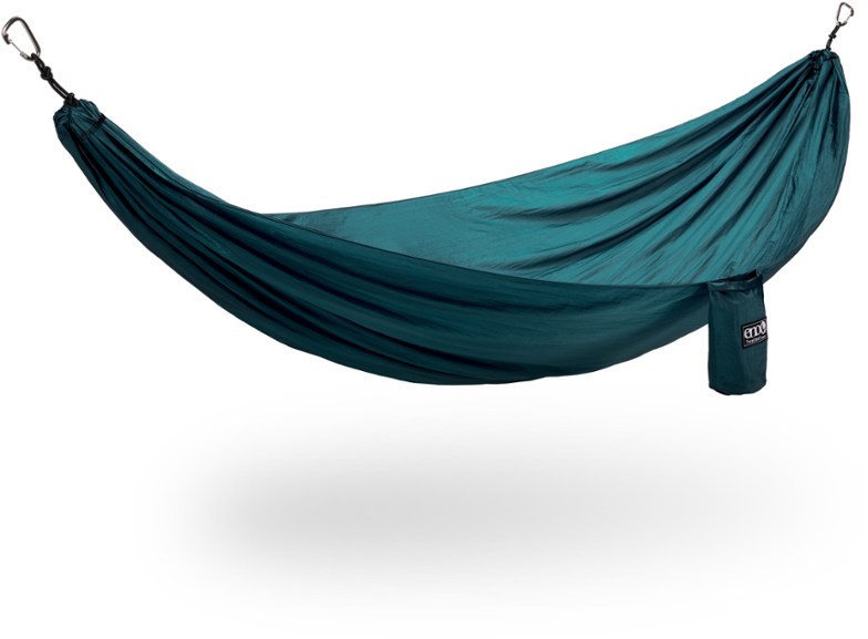 TravelNest Portable Hammock set up in a forest, highlighting its spacious design and adjustable straps.