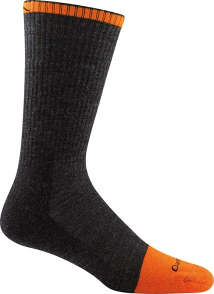 Men wearing ultimate comfort Merino wool boot socks while hiking on a rocky trail.