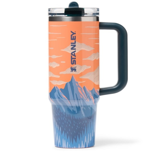 Nature's Honor Flip Straw Tumbler with a scenic background, perfect for outdoor adventures.