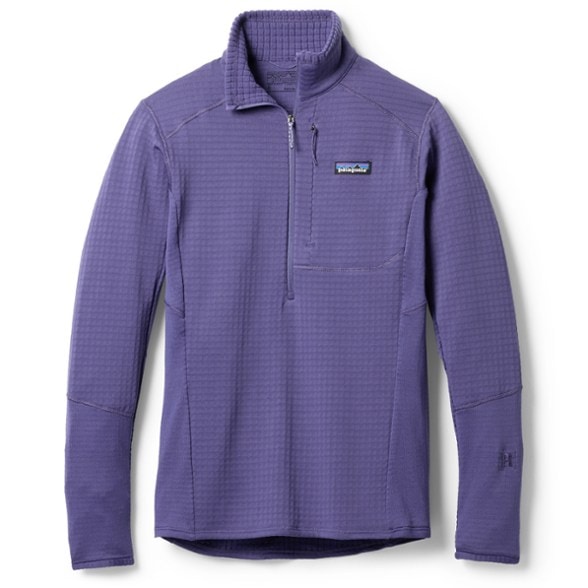 Patagonia R1 Women's Fleece Pullover in action on a hiking trail, highlighting its lightweight design.