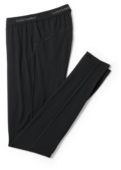 Oasis Merino 200 Thermal Leggings displayed on a snowy mountain trail.