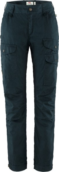 Fjallraven Women's Ventilated Trekking Pants displayed on a hiking trail, highlighting the mesh ventilation openings.
