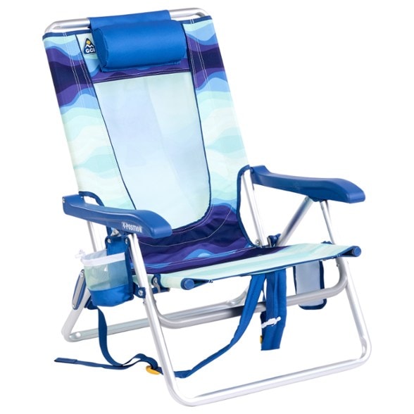 Front view of ComfortPlus Backpack Beach Chair with cup holder on sandy beach.